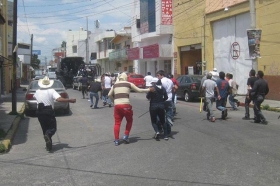 Enfrentamiento comerciantes y policías